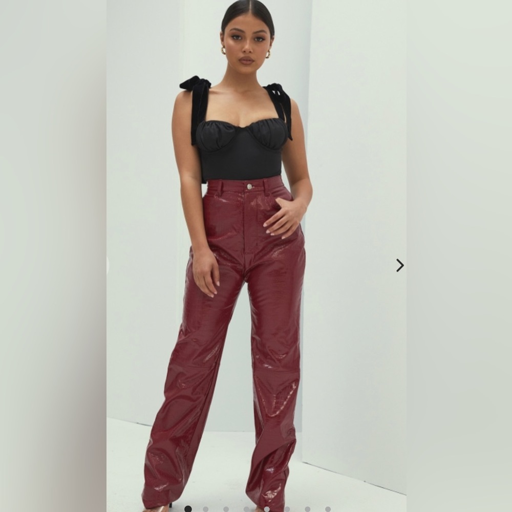 Mistress rocks red leather pants and matching top